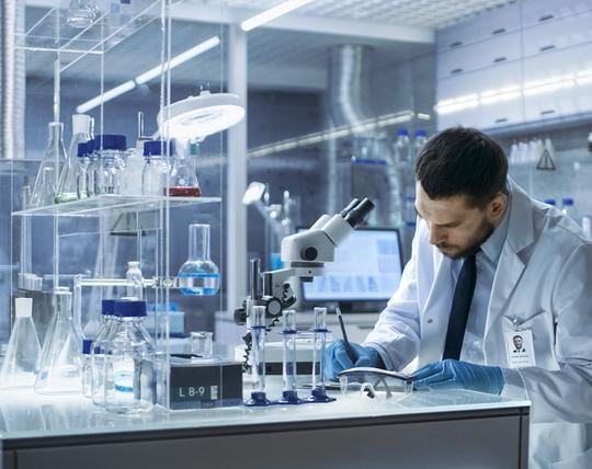 Scientist reviewing test results