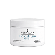 A white plastic jar of KORASANA Colostrum Powder on a clean white background.