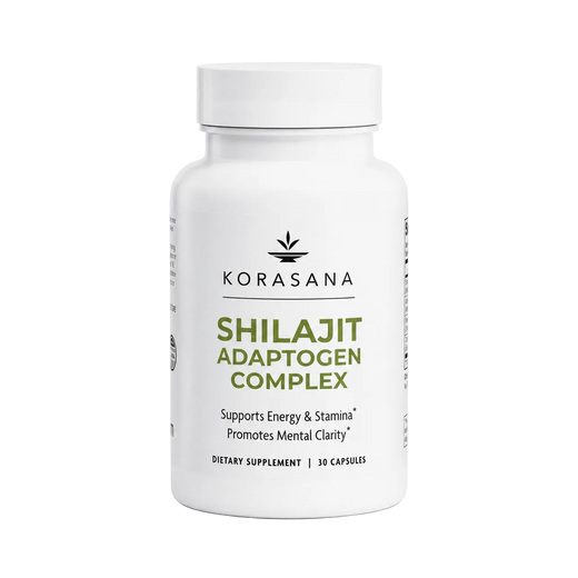 A white bottle of Korasana Shilajit Adaptogen Complex dietary supplement, featuring a white cap and a clean white label with green and black text, set against a light gray background.