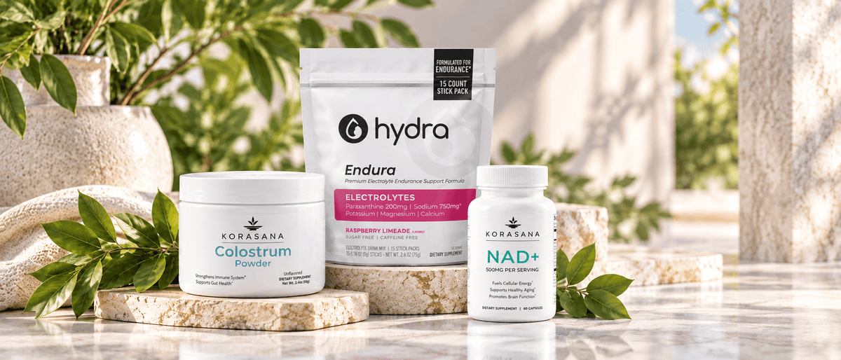 Korasana Colostrum Powder, Hydra Endura, and NAD+ supplements in a bright wellness setting